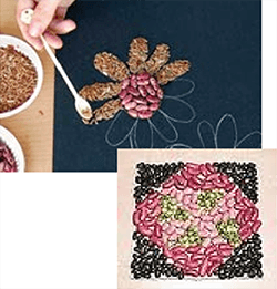 person making flower mosaic from beens and seeds